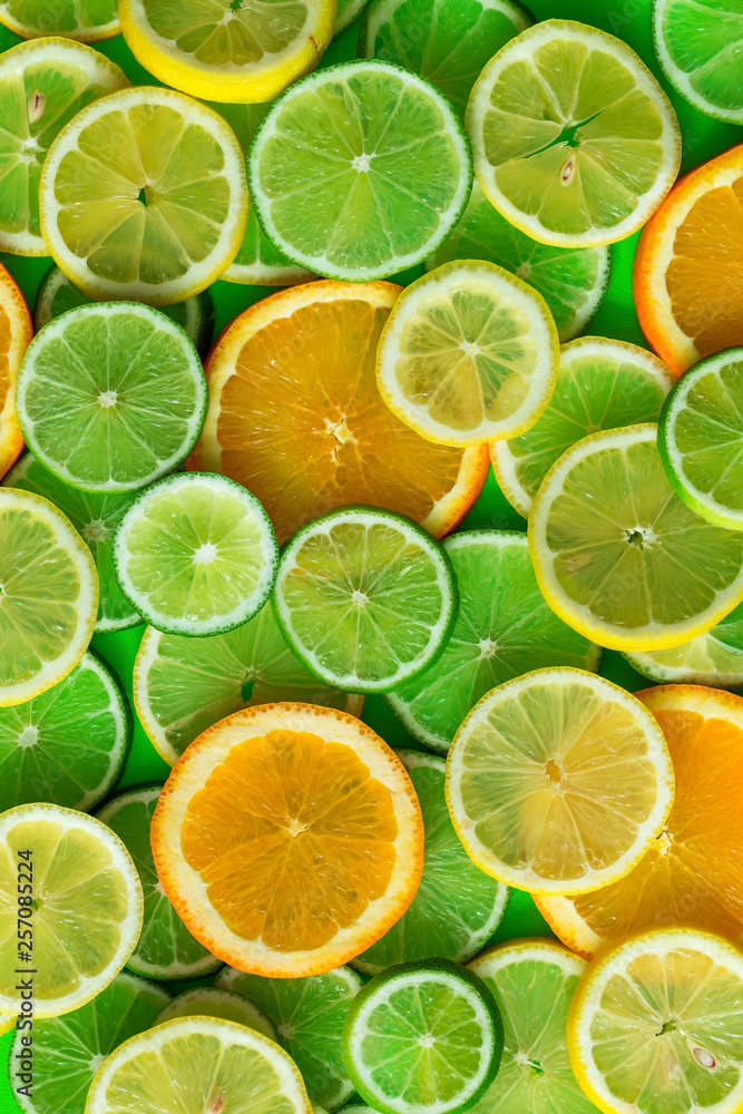 Citrus fruits slices texture background