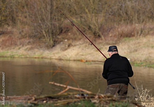 fisherman with fishing rod, Poland