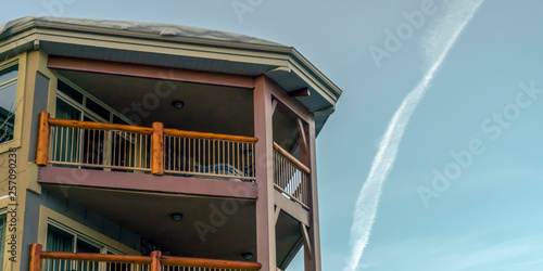 House with balconies in Park City against blue sky
