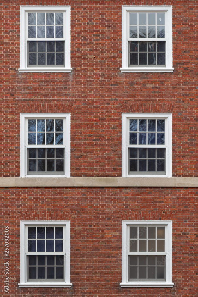 college windows on brick wall