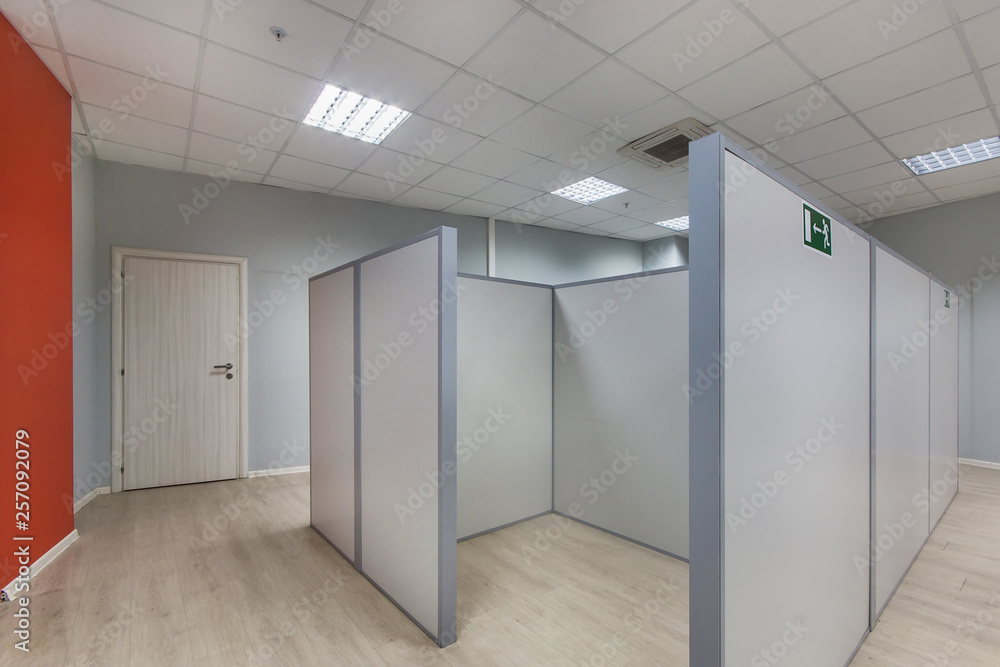 An empty office space with unfurnished cubicles An empty office space with unfurnished cubicles