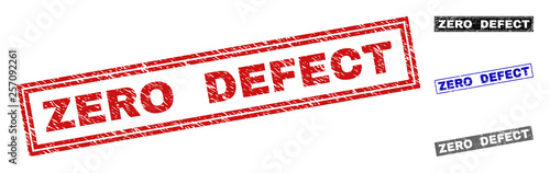 Grunge ZERO DEFECT rectangle stamp seals isolated on a white background. Rectangular seals with grunge texture in red, blue, black and grey colors.