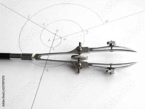 vintage classic drafting drawing tool: double head ruling pen over spiral draw photo