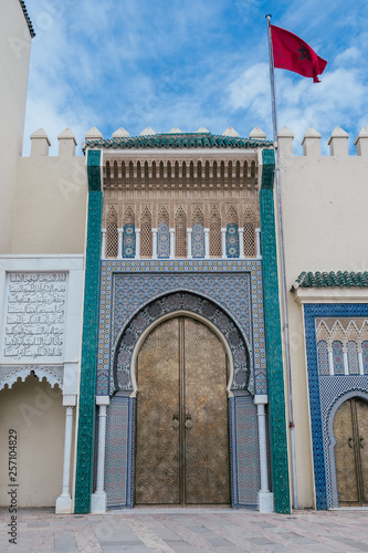 huge golden gate of the Royal Palace of Fez on a beautiful afternoon with blue Sky in Morocco, Africa