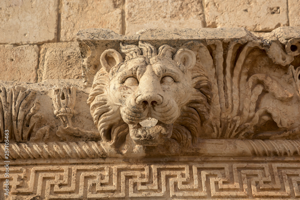 Carved decor of lion head and Roman architecture in limestone in the ancient temple of Bacchus, Jupiter-Baal heritage site, Baalbek, Beqaa Valley, Lebanon