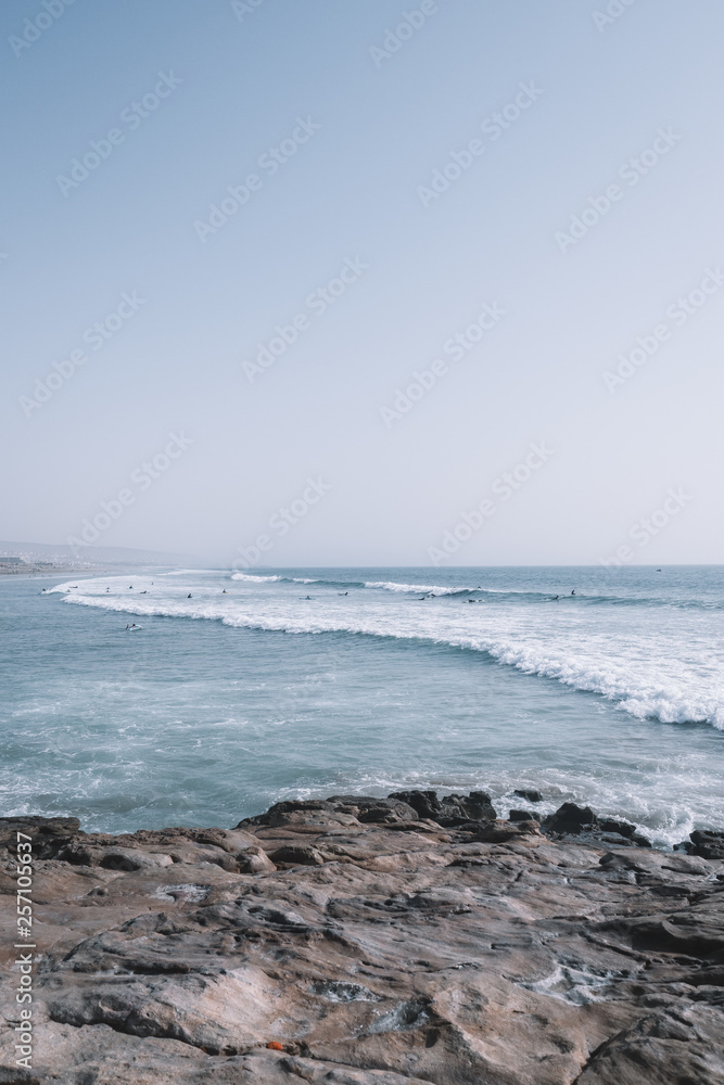 Surfers surfing the Waves of Taghazout at the West Coast of Morocco, Africa