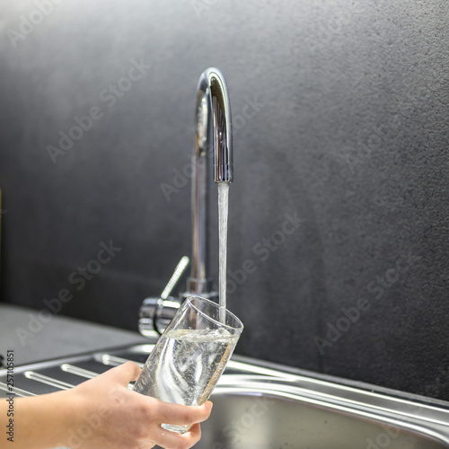 filling up glass with water