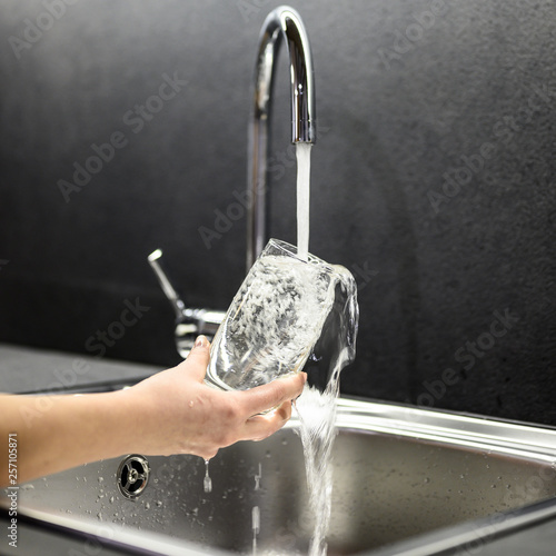 filling up glass with water