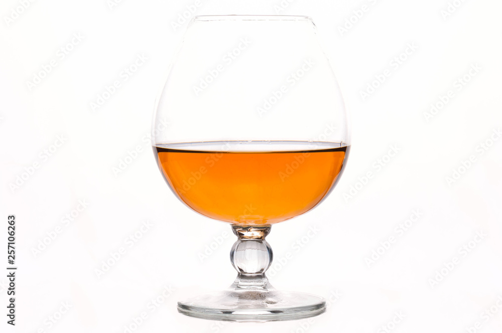 brown scotch in transparent glass isolated on white brown scotch in transparent glass isolated on white