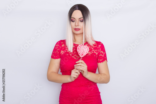 Blonde woman with heart candy in her hands © yevgeniya131988