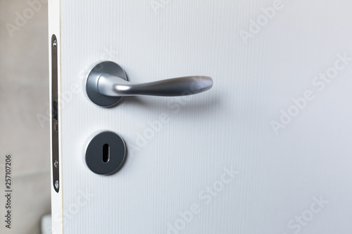 white door with chrome handle