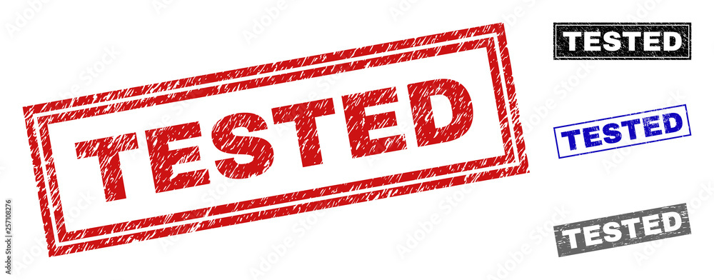 Grunge TESTED rectangle stamp seals isolated on a white background. Rectangular seals with grunge texture in red, blue, black and gray colors. Grunge TESTED rectangle stamp seals isolated on a white background. Rectangular seals with grunge texture in red, blue, black and gray colors.