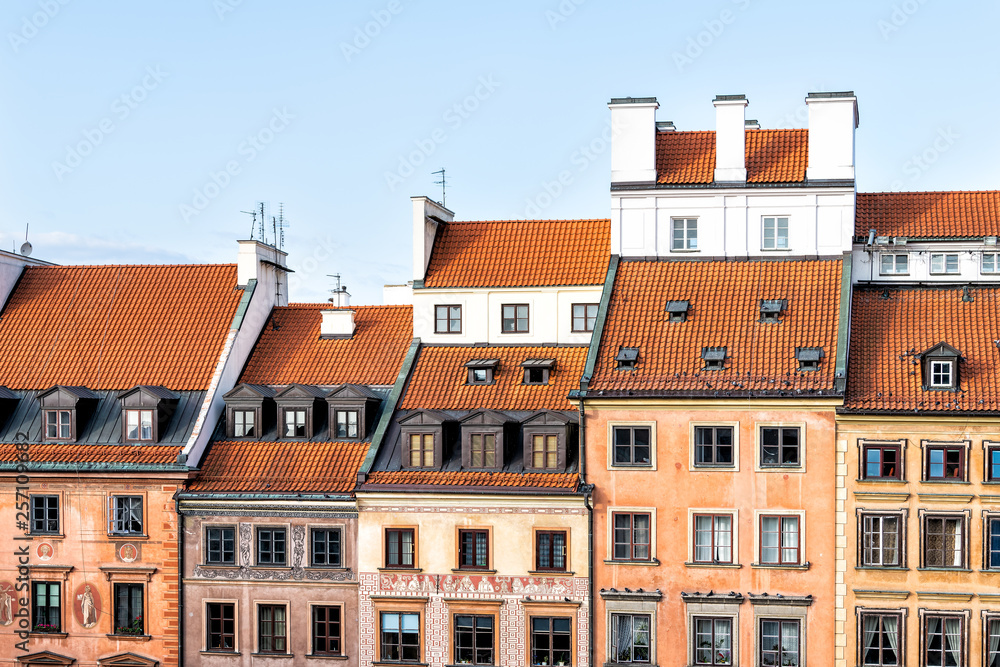Fototapeta premium Warsaw, Poland red orange roof in old town market square with historic street town architecture and windows rooftop closeup pattern