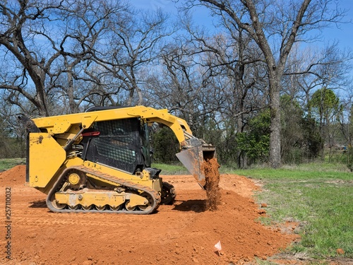 Skid Steer Loader Pouring Dirt