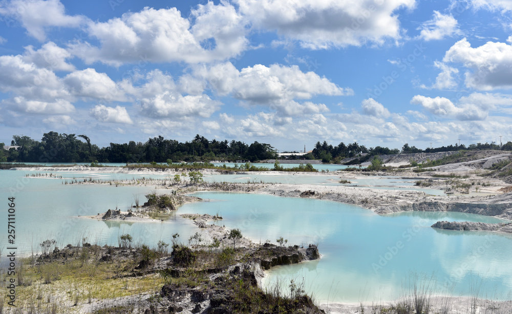 Kaolin Lake in Belitung Island, the water's vibrant light blue contrasting the white sandstone makes for an astonishing view, Indonesia Kaolin Lake in Belitung Island, the water's vibrant light blue contrasting the white sandstone makes for an astonishing view, Indonesia