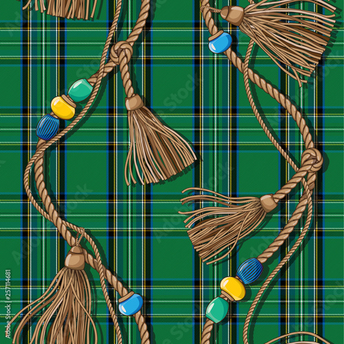 Scottish-style checkered pattern with golden weaves of ropes, tassels and beads. Tartan. Wool green fabric.