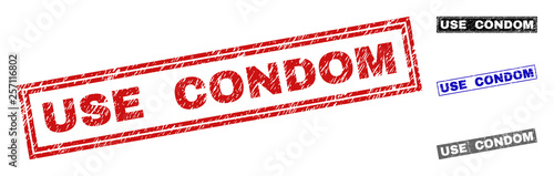 Grunge USE CONDOM rectangle stamp seals isolated on a white background. Rectangular seals with grunge texture in red, blue, black and gray colors.