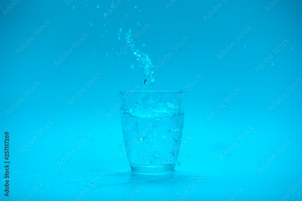 Glass of water with splash isolated on white background Glass of water with splash isolated on white background