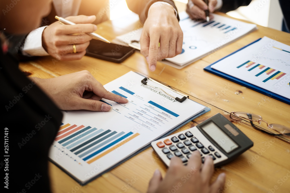 Business team professionals working analyzing data with financial report in the office. Accounting concept. Business team professionals working analyzing data with financial report in the office. Accounting concept.