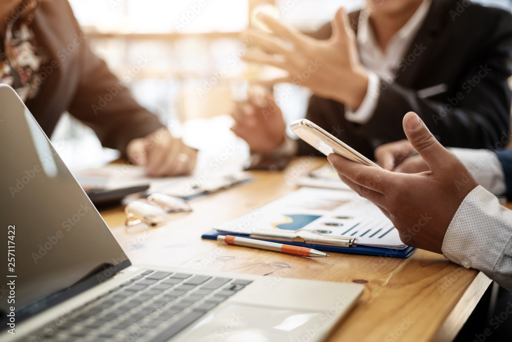Business man using phone while meeting for share financial report in conference room . Accounting concept. Business man using phone while meeting for share financial report in conference room . Accounting concept.