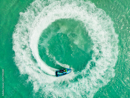 Aerial view of Jet ski and drawing with Jet ski on the sea. Amazing nature background, © AU USAnakul+