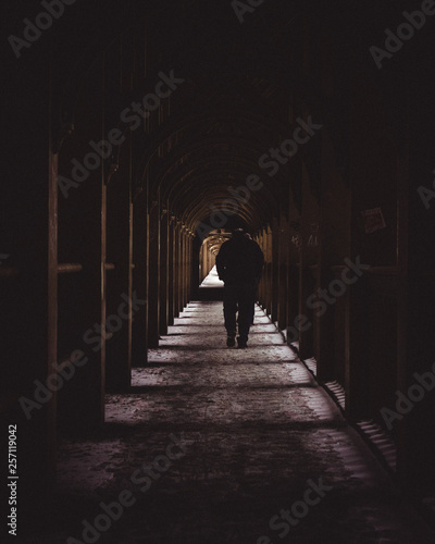 man walking in the tunnel