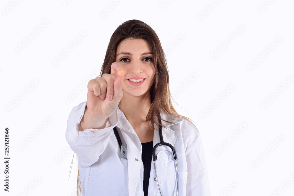 Female doctor with stethoscope and pill. Female doctor with stethoscope and pill.