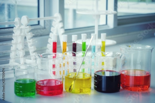 Chemical tube set development and pharmacy in laboratory with multicolored substances in laboratory - Image