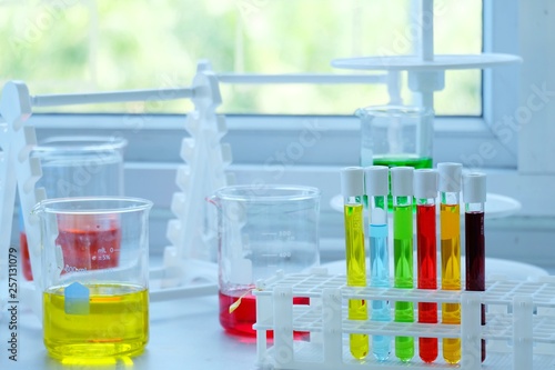 Chemical tube set development and pharmacy in laboratory with multicolored substances in laboratory - Image