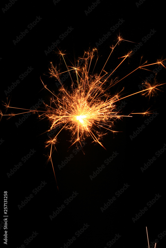 yellow sparks on a black background