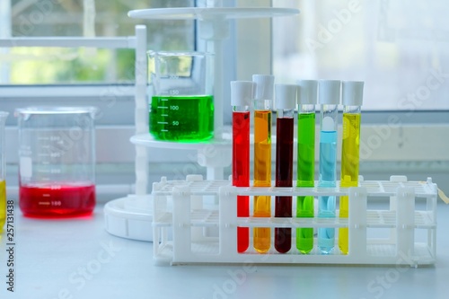 Chemical tube set development and pharmacy in laboratory with multicolored substances in laboratory - Image