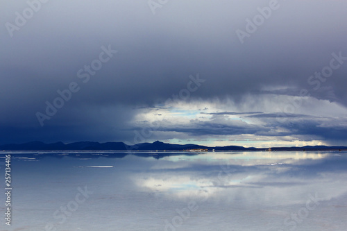 Uyuni salt lake in Bolivia. Dark clouds.