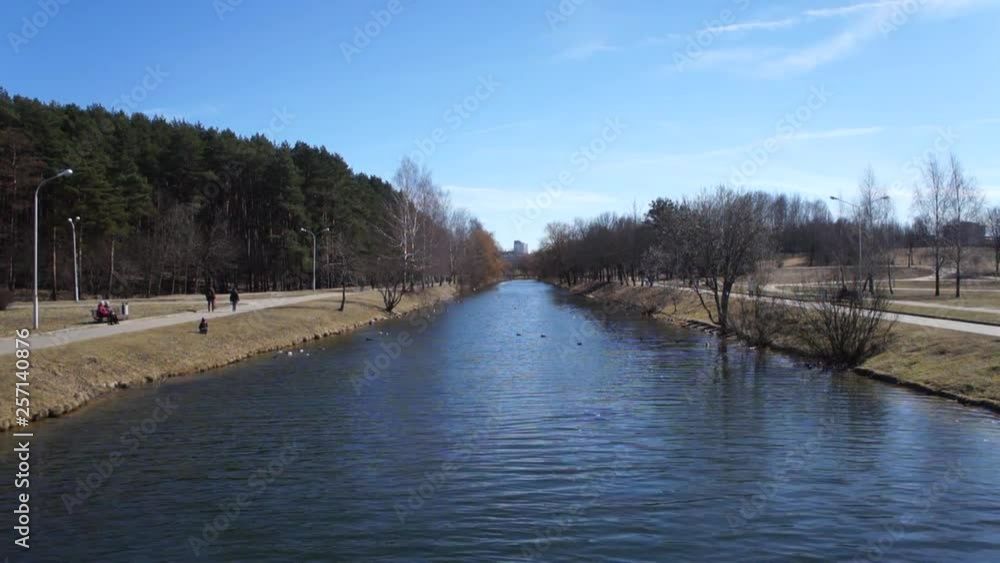 River in the park. Blue water. Spring. River in the park. Blue water. Spring.