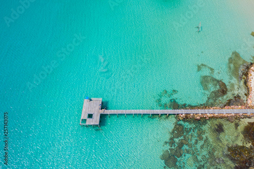 Aerial view. Beautiful tropical beach and wooden bridge in the sea in island Koh Kood Thailand © Sunday Stock
