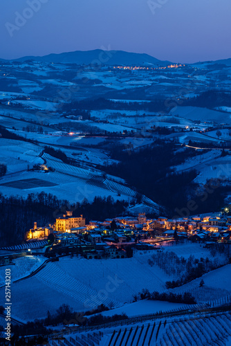 Barolo village panorama in Langhe hills in winter, blue hour