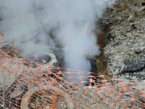 Obraz na płótnie Excavated underground pipeline with a breakthrough and steam w salonie