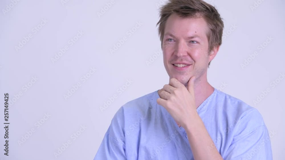 Face of happy young man patient thinking and looking up Face of happy young man patient thinking and looking up