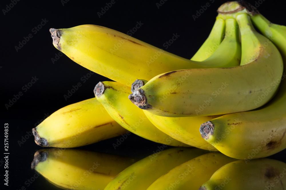 Banana on the tray on dark background.