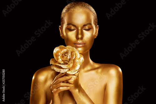 Gold Fashion Model Beauty Portrait with Rose Flower, Golden Woman Art Luxury Makeup on studio black background