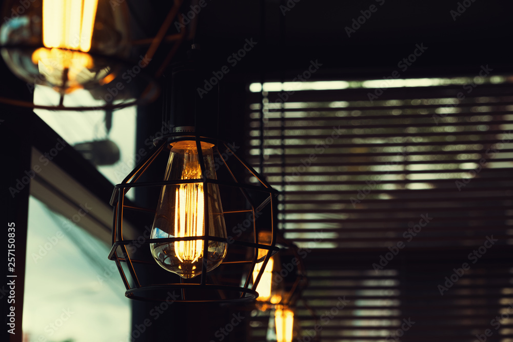 Beautiful vintage luxury light lamp hanging decor glowing in dark. Retro filter effect style.