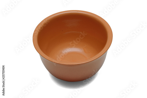 Ceramic bowl for sauces or soups of brown color isolated on a white background