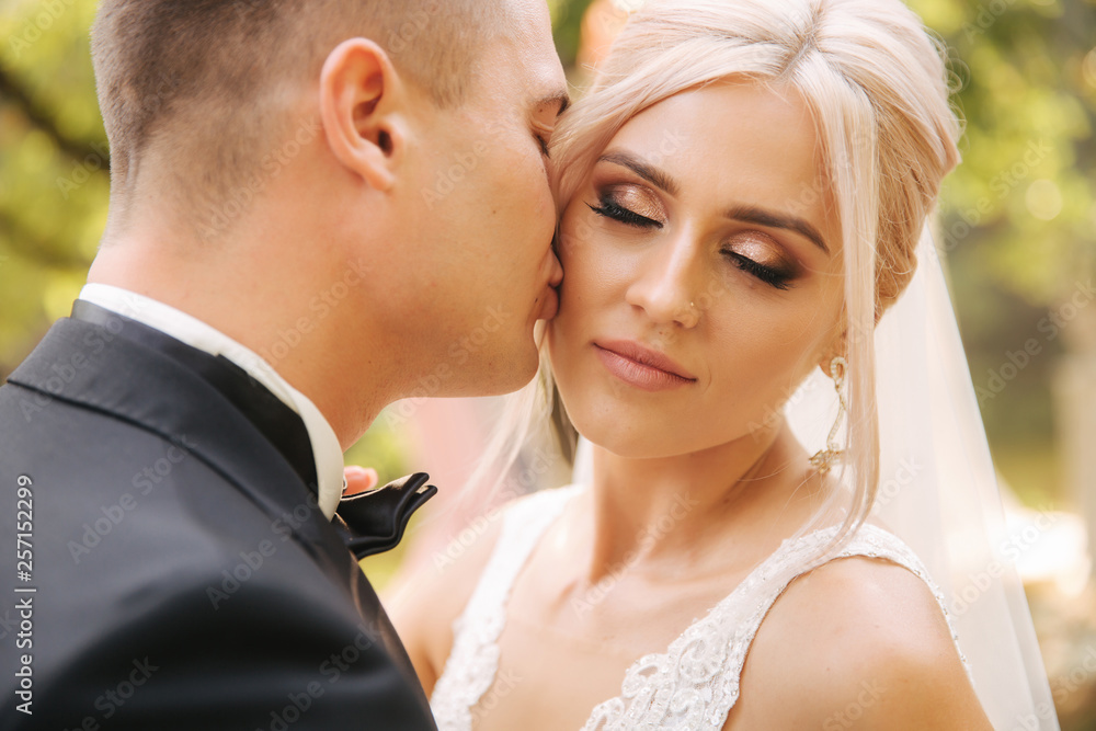 Close up of groom and bride. Portrait of newlyweds outside Close up of groom and bride. Portrait of newlyweds outside