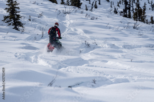 Rider on snowmachine riding Arctic Cat Sled