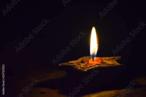 Canvas Print burning candle on black background in india diwali festival