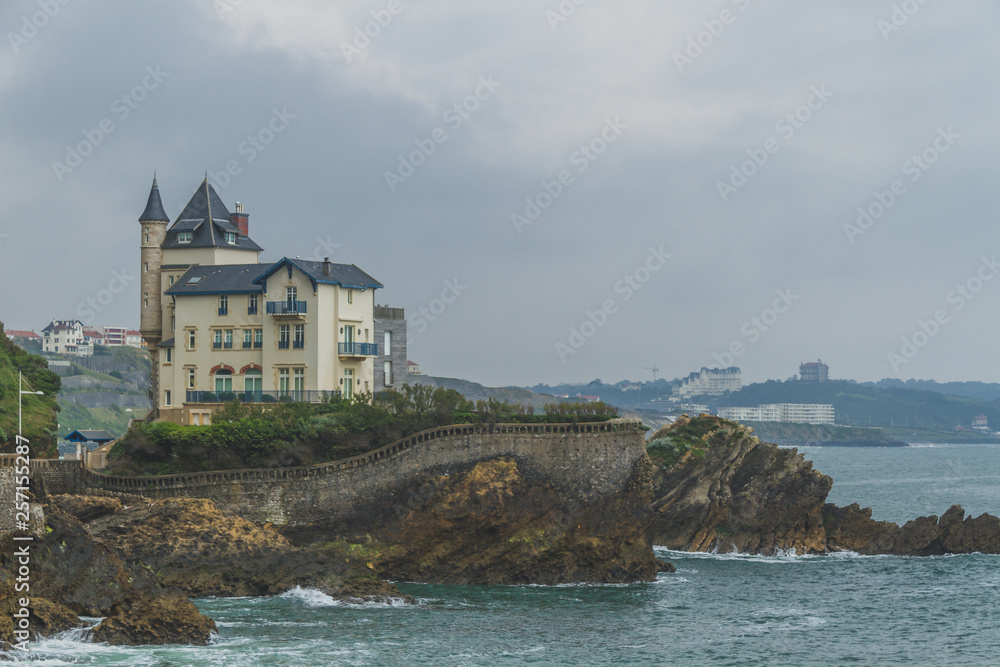 House on rocks by coastline in Biarritz, France