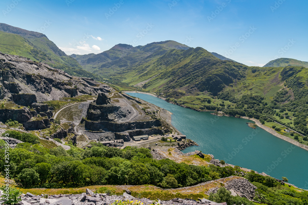 View from Dinorwic Quarry, near Llanberis, Gwynedd, Wales, UK - with Llyn Peris, the Dinorwig Power Station Facilities and Mount Snowdon in the background View from Dinorwic Quarry, near Llanberis, Gwynedd, Wales, UK - with Llyn Peris, the Dinorwig Power Station Facilities and Mount Snowdon in the background