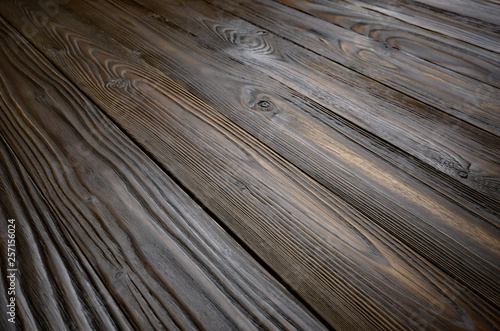 Natural dark wooden textured background of flat layed planks with weathered vintage oiled surface