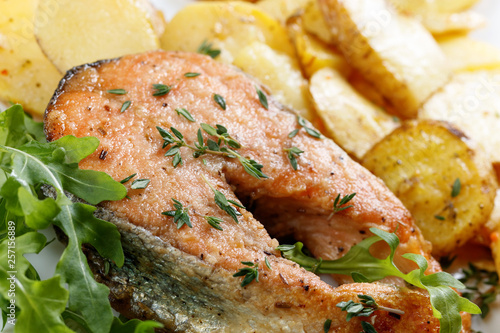 Roasted salmon with potatoes.