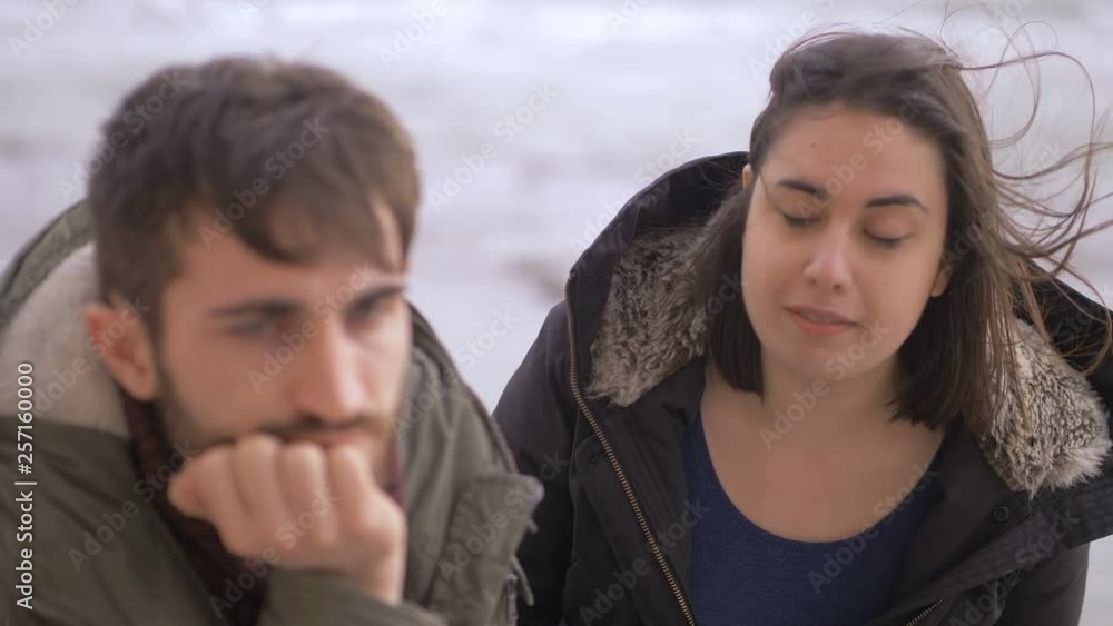 betrayed,angry woman arguing with her serious and silent boyfriend-outdoor betrayed,angry woman arguing with her serious and silent boyfriend-outdoor
