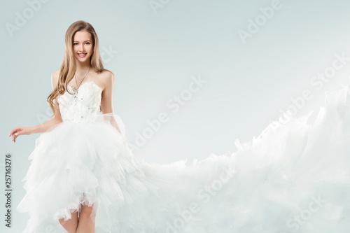 Fashion Model White Dress, Young Woman in Gown with Long Tail Train, Happy Girl Beauty Studio Portrait